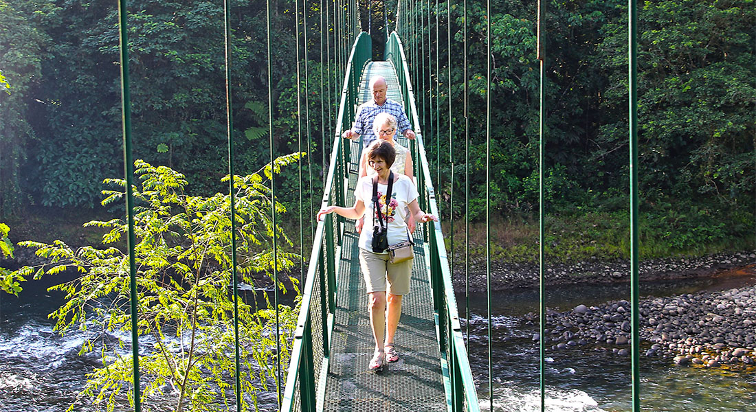 travelers on bridge costa rica